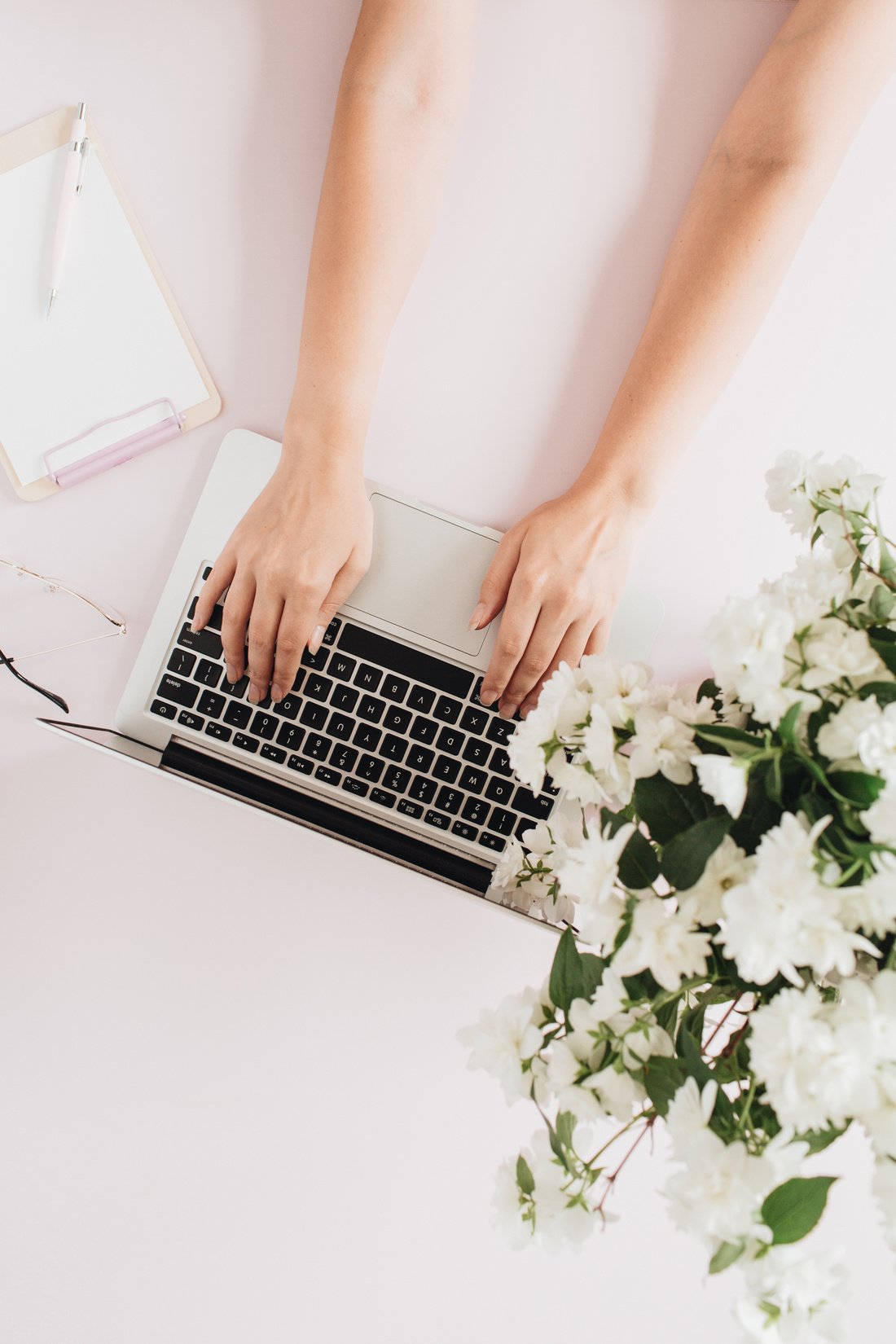 Woman Typing Laptop in a Minimal Boho Office Desk 